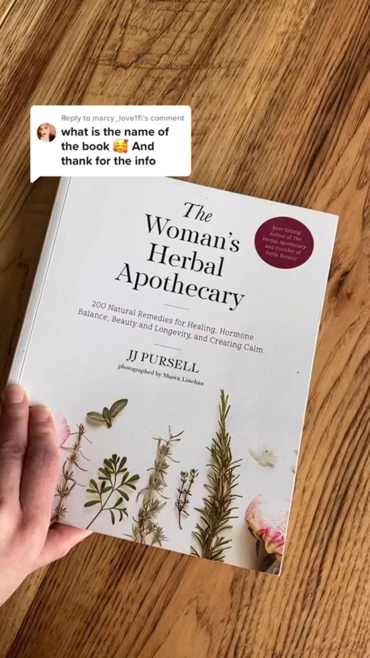 the woman's herbal apothecary by j p russell is displayed on a table