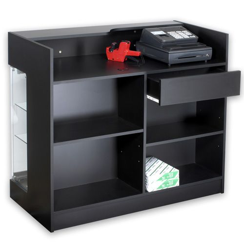 a black shelf with two drawers and a red object on top