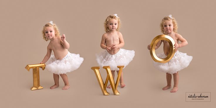 three baby girls in tutues standing next to each other with the letter w