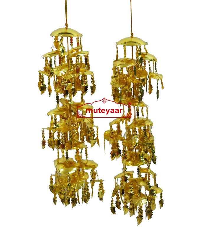 two golden chandeliers hanging from the ceiling