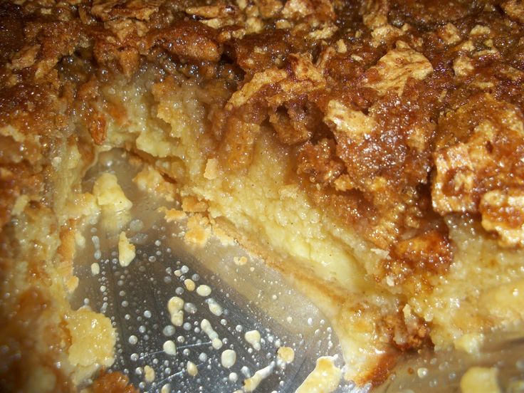 a close up view of some food in a pan with water on the bottom and one slice missing