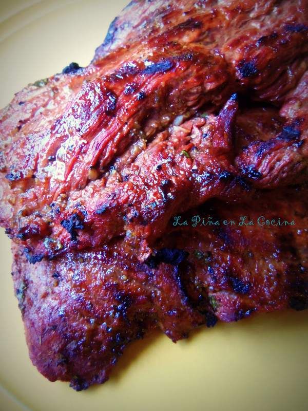 two pieces of meat sitting on top of a yellow plate