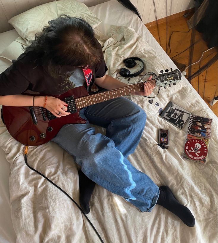 guitar Guitar Leaning Against Wall, Someone Holding A Guitar, Musical Senior Pictures, Learning Guitar Aesthetic, Electric Guitar Photoshoot, Electric Guitar Pose, Bass Photoshoot, Someone Playing Guitar, Guitar Photoshoot Ideas