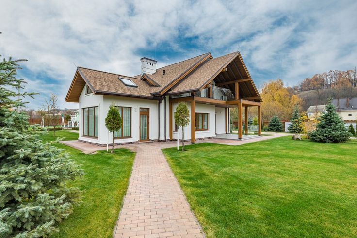 a house with a walkway leading to the front door