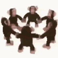 a group of people standing around each other in the middle of a circle with their hands together