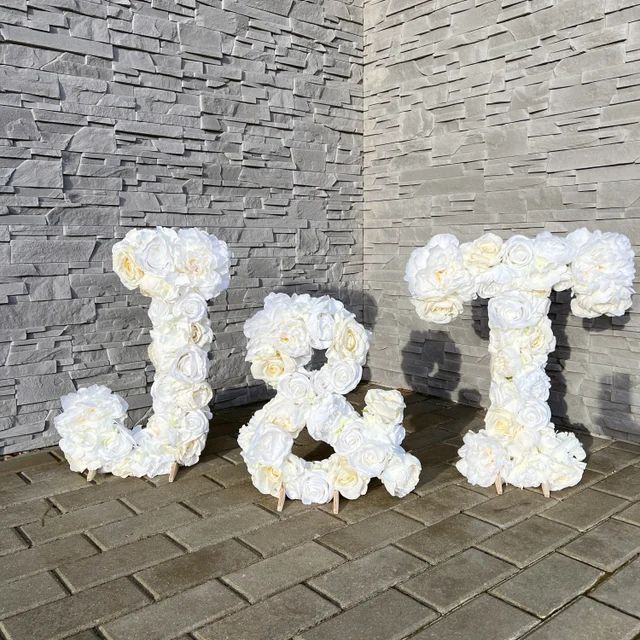 the letters are made out of white flowers