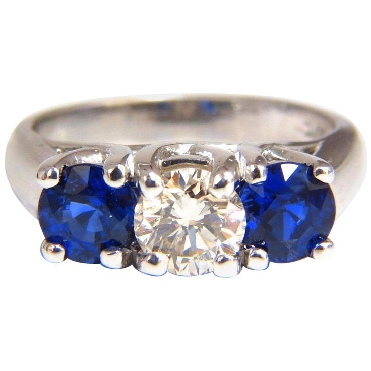 Classic Diamond & Sapphires, Three Stone .80ct. Round Cut diamond Full Cut Brilliant J-color Vs-2 Clarity 5.8mm Side Round Natural Blue Sapphires: 1.68ct. Vibrant Royal Blue & transparent Full cut and Full Faceted. Gorgeous three stone ring 5.4 grams current ring size: 5.25 & We May Resize. Please inquire. 14Kt White gold $15,000 appraisal will accompany. Luxury Three Stone Blue Topaz Ring, Classic Diamond Gemstone With Center Stone, Classic Platinum Gemstones Gia Certified, Classic Gia Certified Platinum Gemstones, Gia Certified Platinum Classic Gemstones, Classic Round Cut Diamond Gemstones, Classic Sapphire Gemstones With Brilliant Cut, Three Stone Diamond Gemstones For Anniversary, Brilliant Cut Sapphire Diamond Gemstones