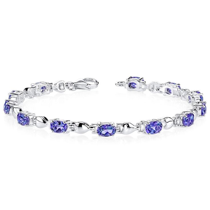 A cocktail of colors Melt into the precious moments of your day with the show stopping, chameleon-like beauty of this Alexandrite. This standout bracelet features oval shape Peora simulated Alexandrite gemstones in .925 sterling silver. Technically crafted and cut for optimum brilliance, our simulated Alexandrite gemstones are optically identical to their mined counterparts, but they are made using alternative materials. We're big fans of eco-luxury. Handcrafted in pure .925 sterling silver goodness, this bracelet has been carefully coated in an elegant rhodium finish. Our artisans are expertly trained in this process which fortifies the bracelet's strength, shine and brilliance. Main Stone Simulated Alexandrite 5.5 Carats, Oval shape, 6 x 4 mm Color changing gemstone with a SI1-SI2 clarit Jewelry Questions, Blue Sapphire Bracelet, Amethyst Studs, Blue Sapphire Gemstone, Sports Jewelry, Rings Vintage, Discount Jewelry, Expensive Jewelry, Sapphire Bracelet