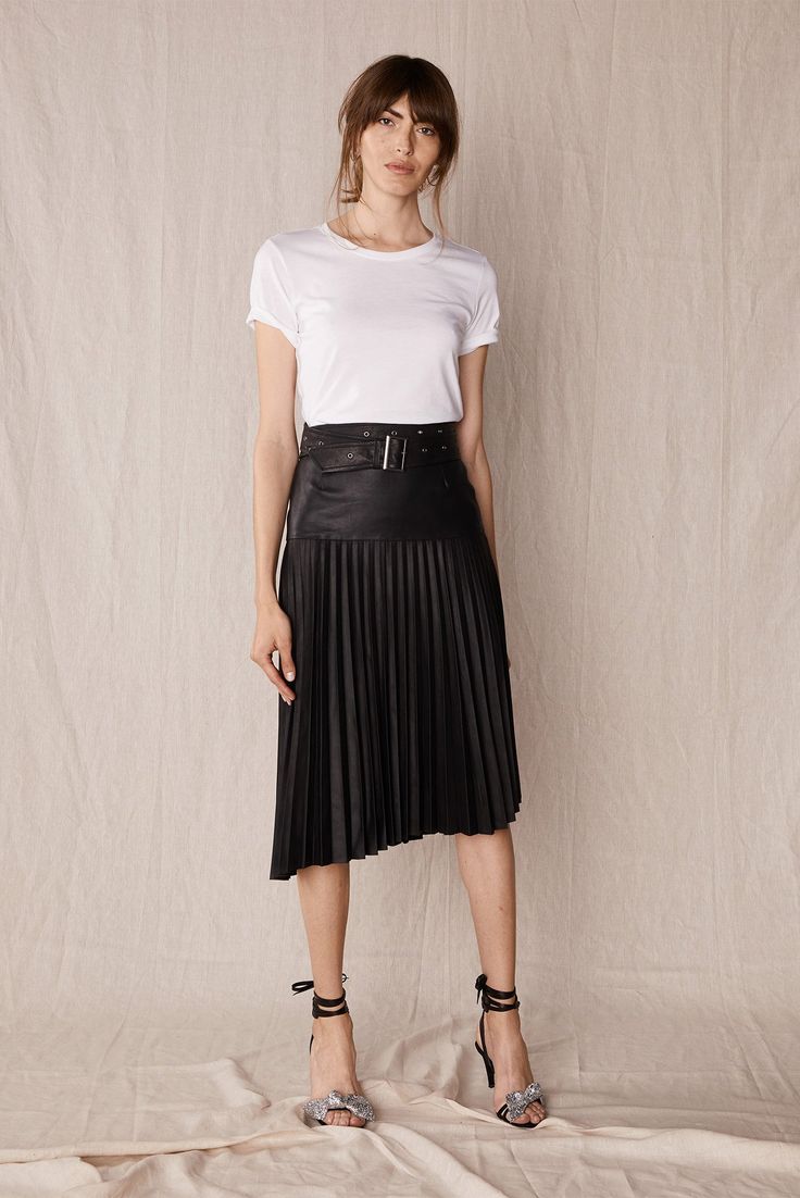 A true elevated wardrobe essential, The Park Avenue Pleat Skirt in ultra-luxe, lightweight nappa goatskin leather with slight distressed finish. asymmetrical uneven hemline slight aline skirt shape delicate knife pleating banded waistband with vertical darts hidden centre back zipper mid to high calf length raw leather surface lined 100% Genuine Nappa Goat Leather 97% Polyester & 3% Spandex lining Please note The Long Island Belt is sold separately. IN STOCK: S & L LIMITED UNITS availabl Pleated Skirt Black, Timeless Fashion Pieces, Knife Pleat, Leather Pleated Skirt, Raw Leather, Pleat Skirt, Aline Skirt, Fashion Buyer, Park Avenue