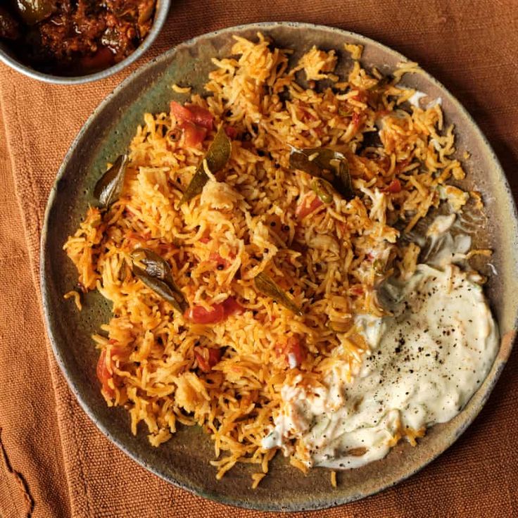 a plate filled with rice and other food items