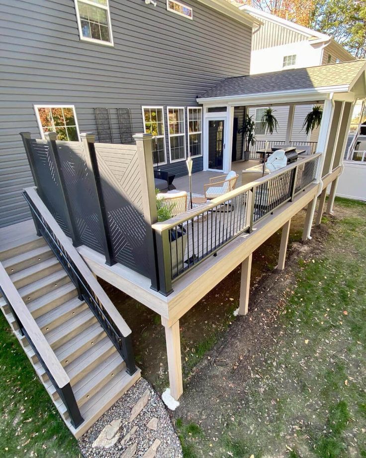 a house that has some stairs leading up to the front door and back porch area