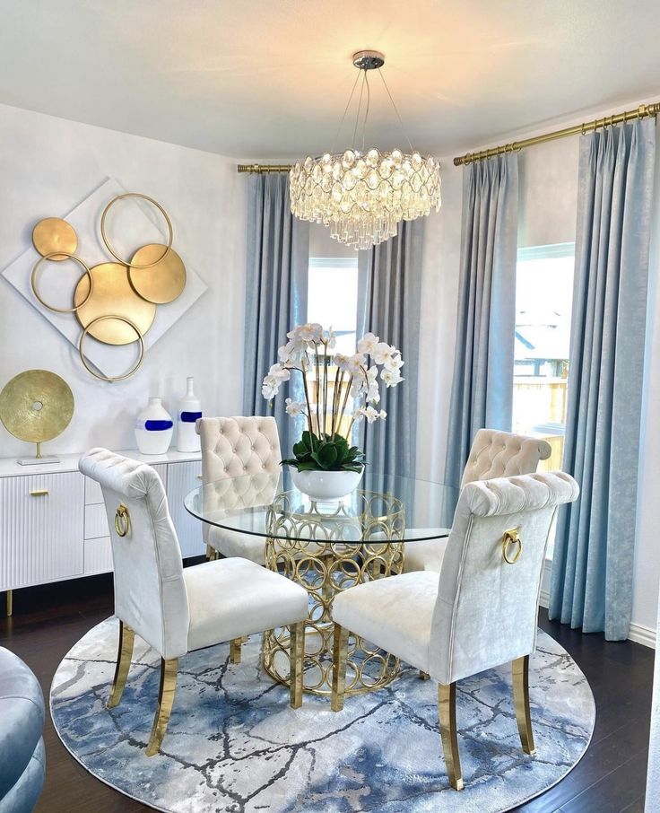 a dining room table with chairs and a chandelier