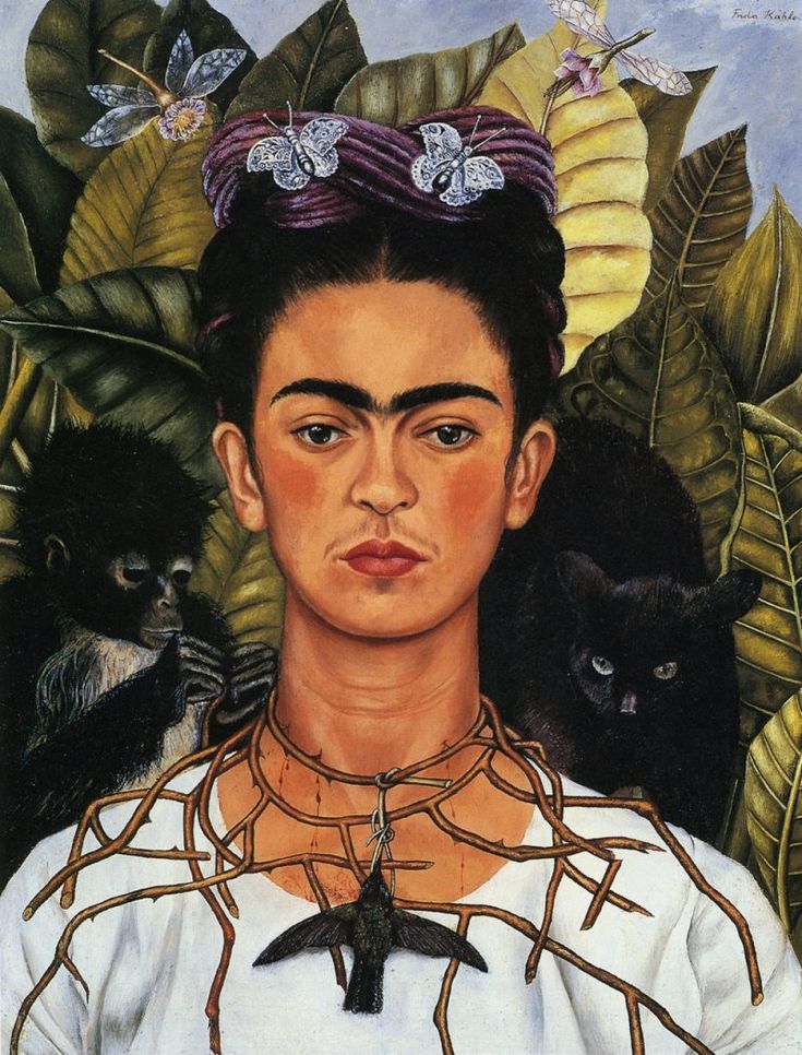 an image of frida with cats in the background