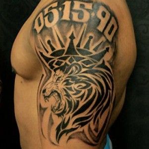 a man with a lion tattoo on his arm