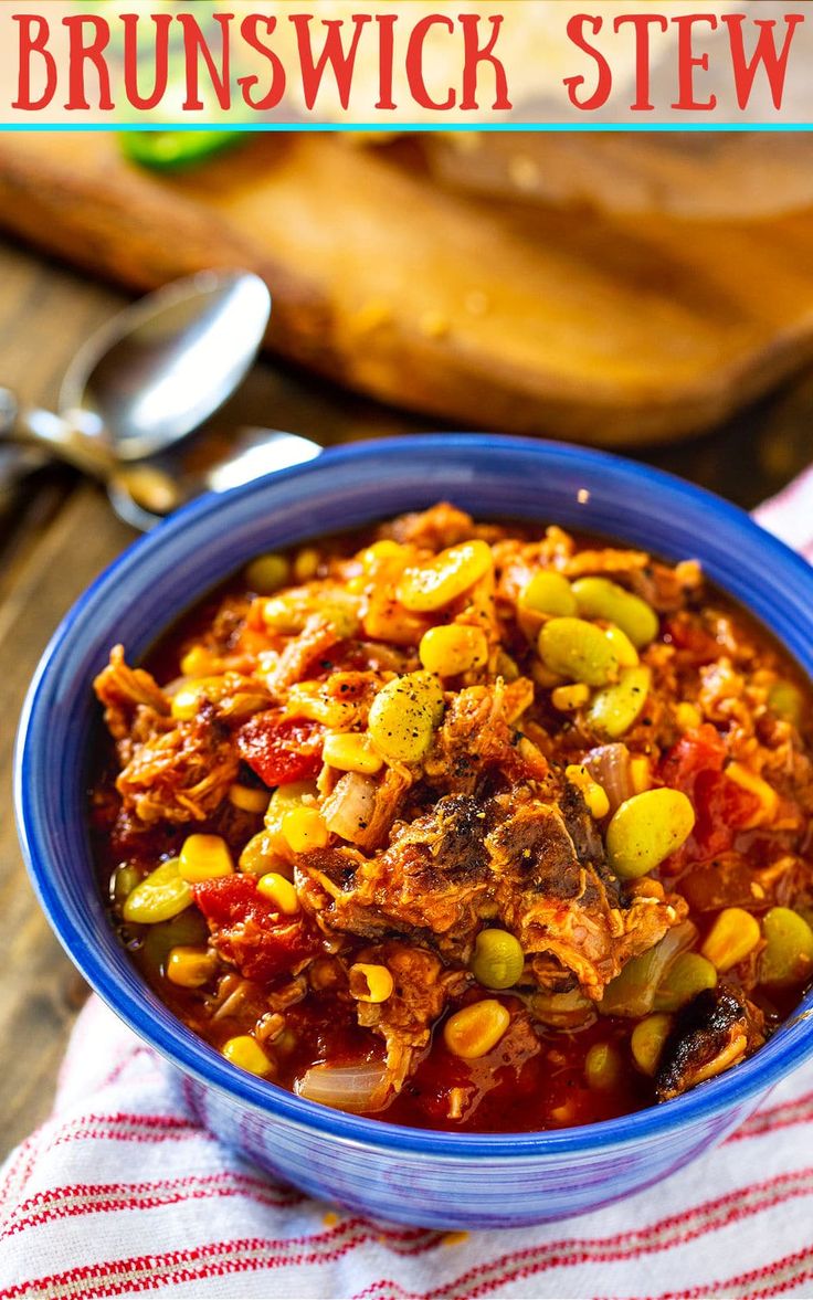 a blue bowl filled with stew and beans