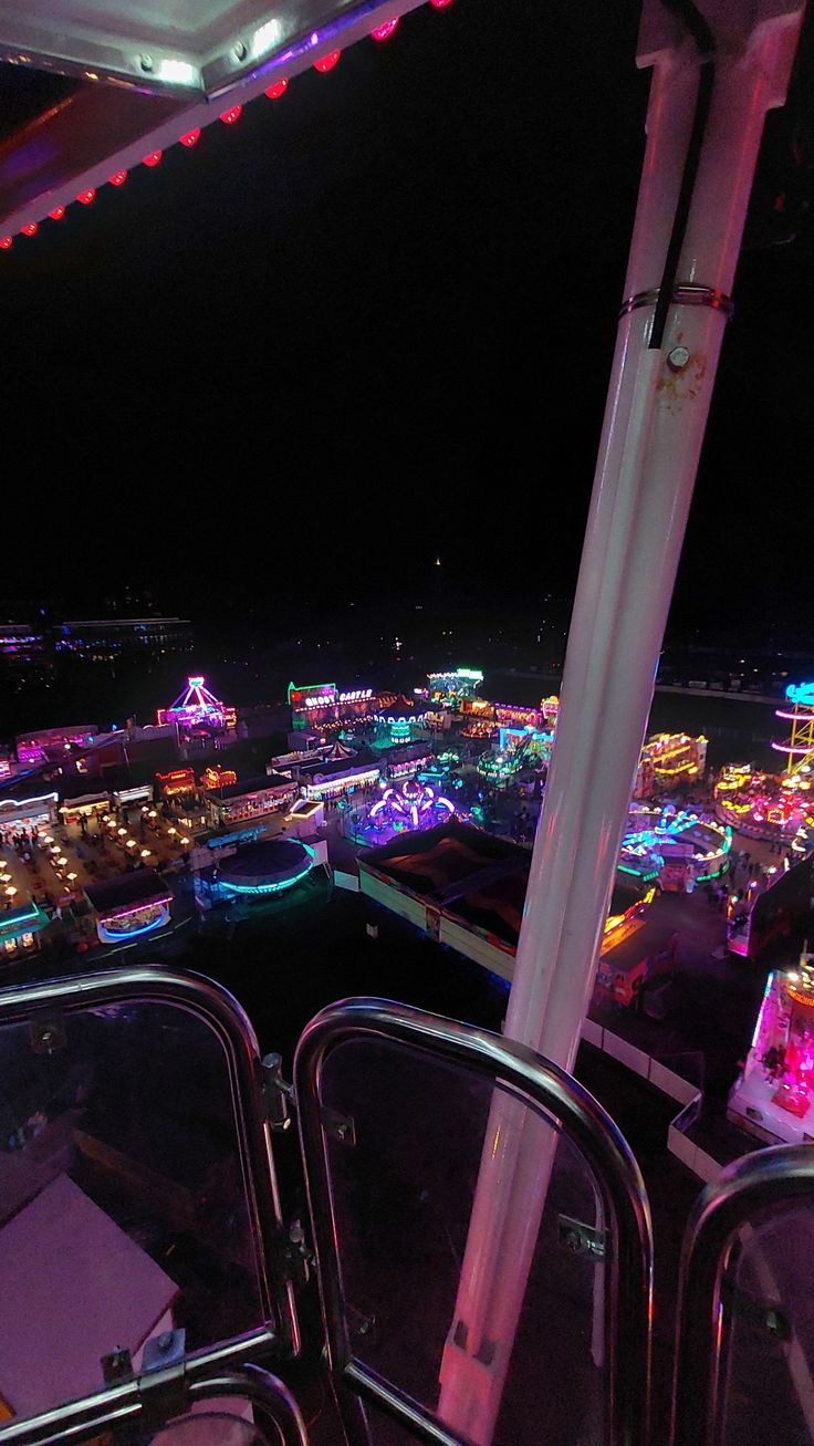 an aerial view of a carnival at night