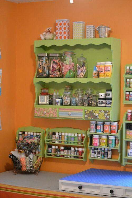 the shelves are filled with various items in this craft room area, including scissors and other crafts