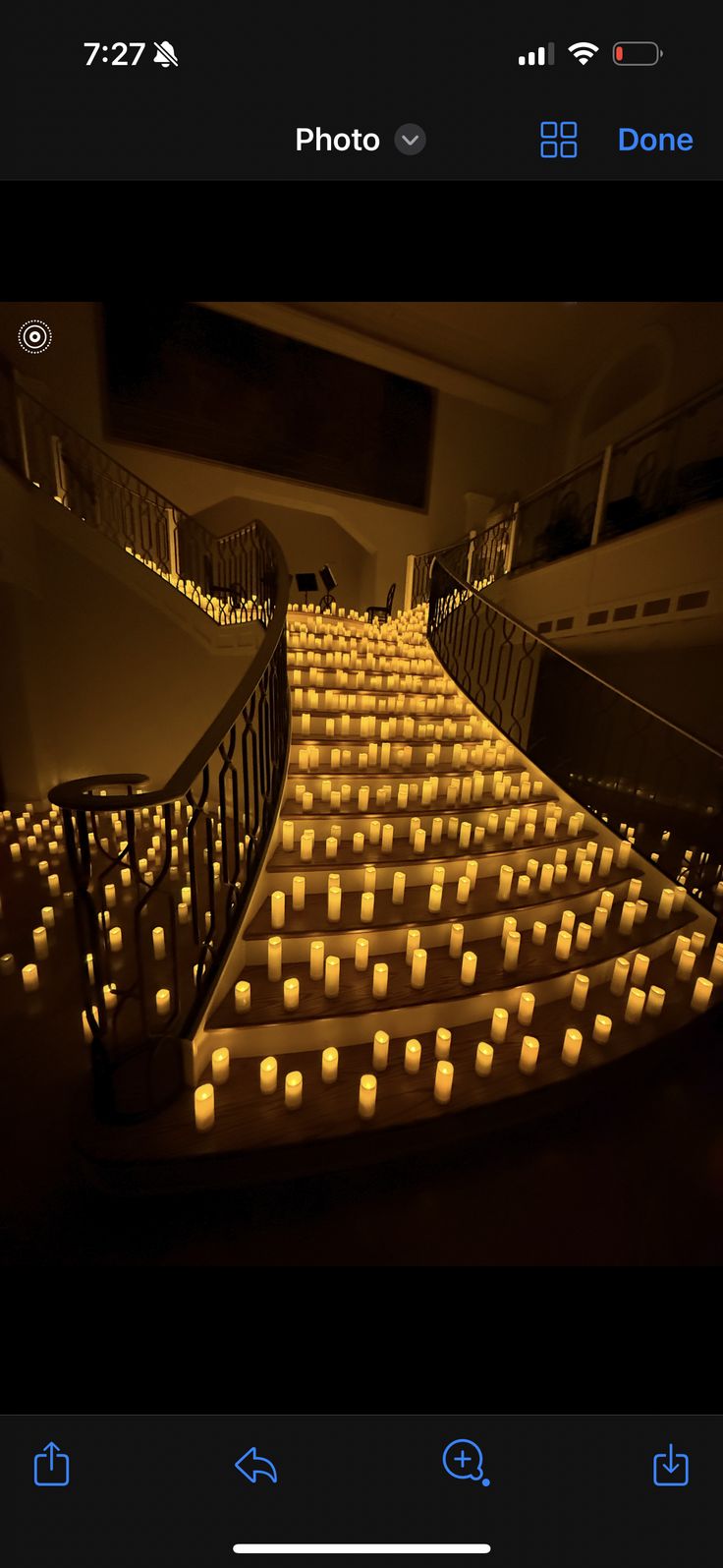 candles are lit up on the stairs in this photo