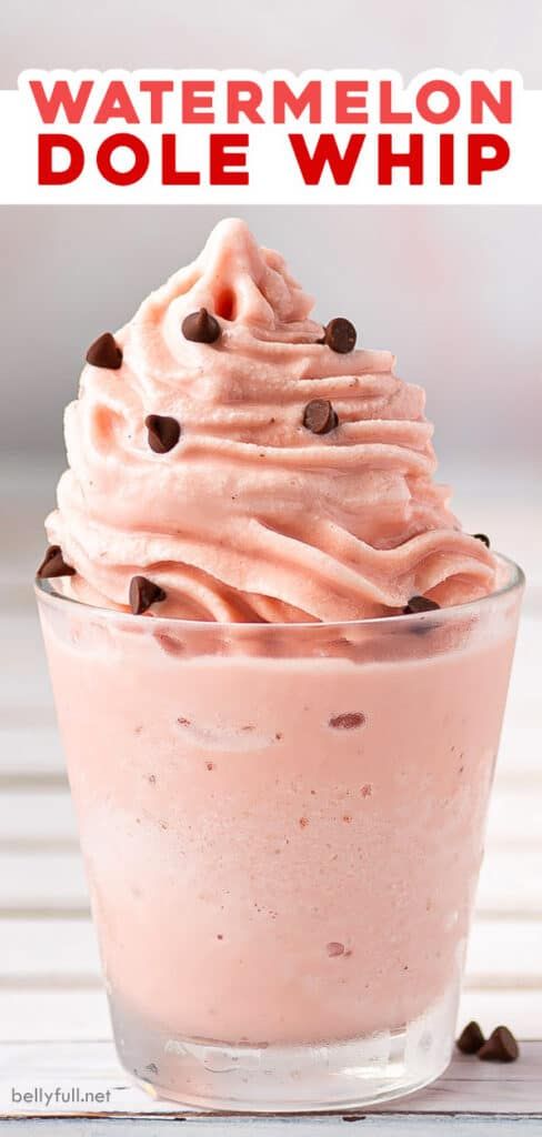 a close up of a dessert in a glass with whipped cream and chocolate chips on top