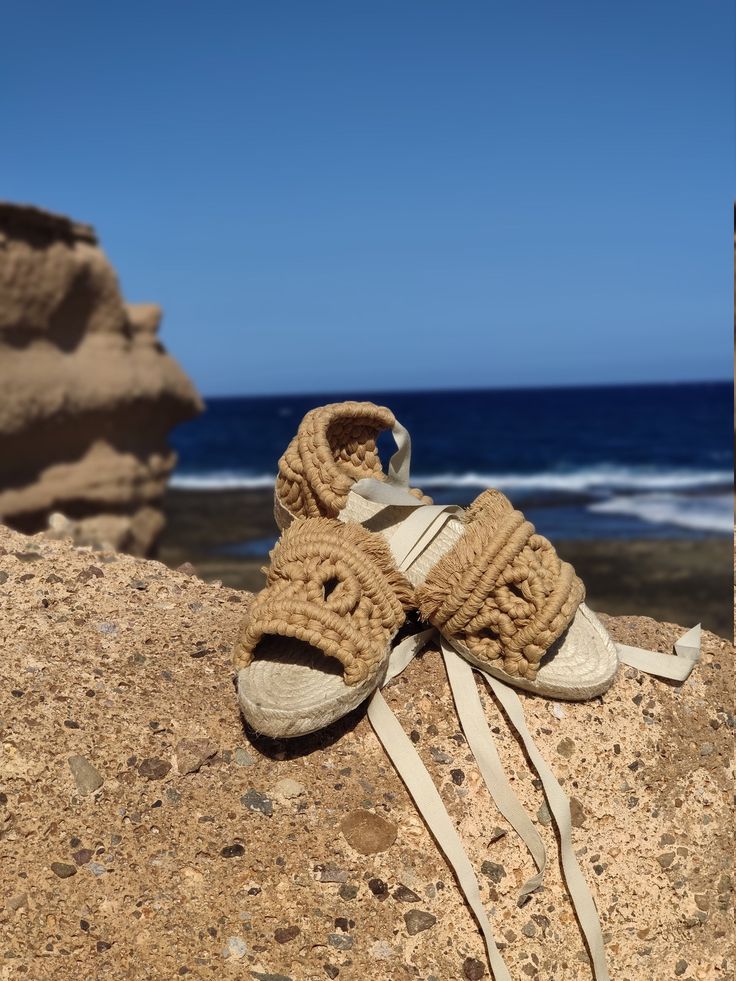 Macrame sandals made with GRS and OEKO-TEK certified recycled cotton. Casual Braided Sandals In Natural Color, Casual Beach Sandals With Rope Detail, Vacation Woven Jute Espadrilles, Beige Jute Sandals For Beach, Natural Jute Sandals With Woven Sole, Summer Natural Espadrilles For Beach Season, Beige Woven Jute Sandals, Natural Color Summer Espadrilles For Beach Season, Summer Style Natural Color Espadrilles For Beach