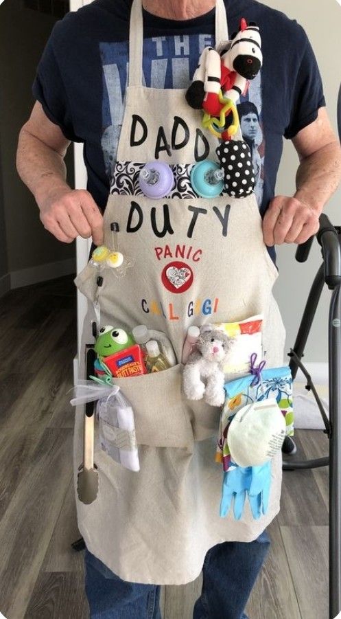 an older man is holding his apron full of toys