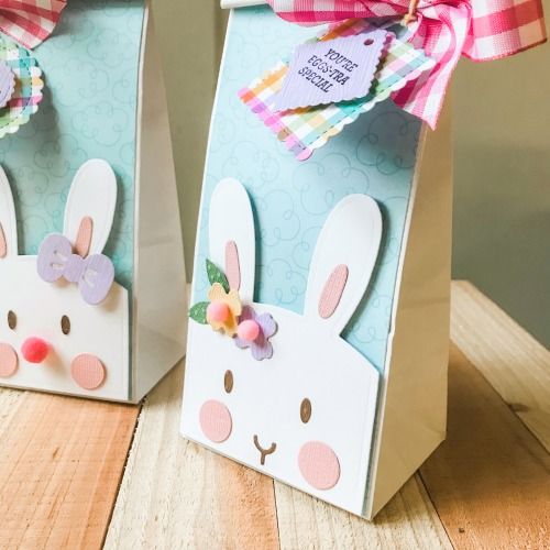 two paper bags with bunny ears on them