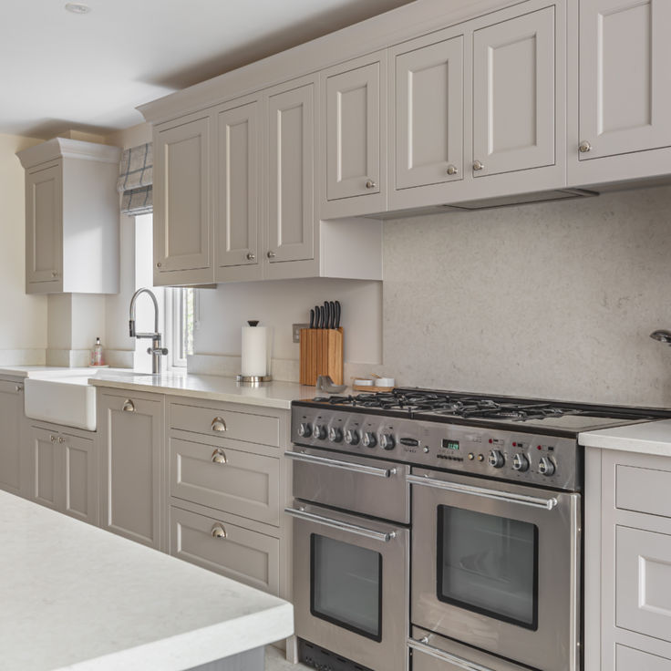 a kitchen with an oven, sink and counter tops in it's center island