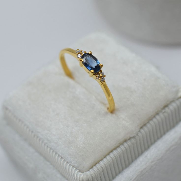 Dainty Sapphire Ring-Blue Sapphire Ring-Oval Cut Sapphire Ring-Stackable Ring-Minimalist Ring-Sterling Silver Ring-14K Solid Gold Ring ❥ Hit on favorite button on shop to get more exciting offers and update for new stock in our shop ❥ Made to order Material: Sterling Silver/10K/14k/18k gold Color Options: Yellow Gold, White Gold, Rose Gold ❥ Center Stone- Natural Blue Sapphire     Size: 3x5mm     Shape: Oval Cut      ❥ Band Width: 1.35 mm ❥ Weight: 1.48 gram approx. (Note:- Weight can be more or less according to the size of the ring) ❥ Shipps within 4-7 business days.  🎁 GIFT WRAPPING * Custom Gift Notes and Gift wrapping is available at our shop. ❥ Why Choose Us? * Well we are experienced with both gemstones and jewelry we are the manufacturers of jewelry.  * Unlike other shops on Etsy Minimalist Sapphire Ring, Fine Jewelry Oval Crystal Ring, Dainty Yellow Gold Rings With Oval Cabochon, Oval Sapphire Stackable Rings For Gift, Oval Sapphire Stackable Rings As A Gift, Oval Ring For Anniversary, Gold Oval Sapphire Cluster Ring, Gold Sapphire Oval Cluster Ring, Oval Sapphire Cluster Ring In Gold