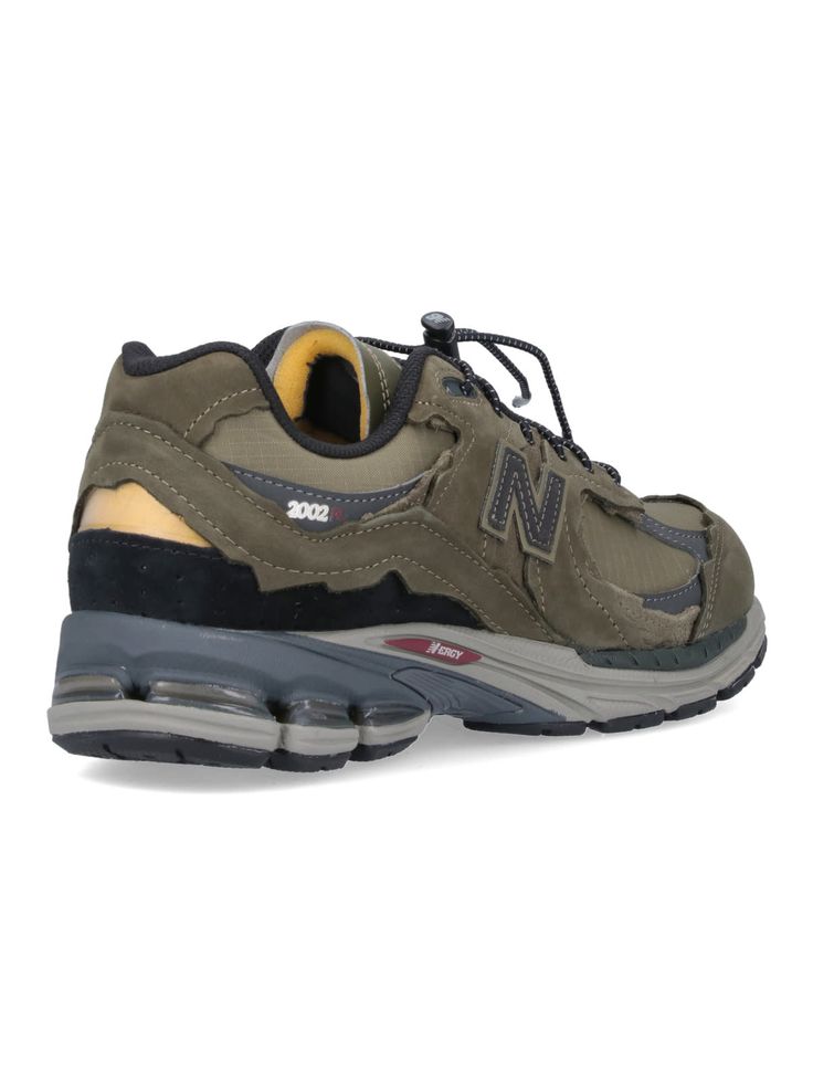 New Balance '2002R Protection Pack' lace-up sneakers in green suede with grey and black details, mesh panels, round toe, side logo patch, side '2002R' print, gray logo tab on the back, two-tone rubber sole. Composition: 100% Leather Urban New Balance Sneakers For Outdoor, New Balance Urban Sneakers For Outdoor, New Balance Green Sneakers With Air Cushioning, Green New Balance Sneakers With Air Cushioning, New Balance Urban Outdoor Sneakers, Functional Walking Shoes For Streetwear With Medium Fit, Green Low-top Trail Running Shoes By New Balance, Green Low-top New Balance Trail Running Shoes, Gray Trail Running Shoes With Vibram Sole For Streetwear