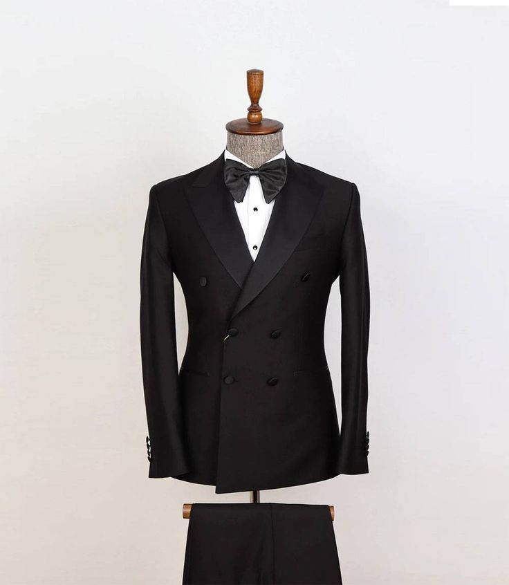 Mens Two Piece Black Tuxedo
Experience timeless sophistication with our Double Breasted Two Piece Men's Black Tuxedo. Meticulously crafted, this tuxedo exudes elegance. The double-breasted jacket features a classic peak lapel and six-button front, channeling vintage charm. Accompanied by impeccably tailored trousers, it ensures a sleek, flattering fit. Perfect for formal events, weddings, or any occasion demanding refinement. Make a statement in this iconic black tuxedo, symbolizing classic soph Fitted Double Breasted Suit For Black Tie Events, Fitted Double Breasted Tuxedo For Black Tie Events, Classic Fitted Suit For Groom, Black Tailored Tuxedo For Formal Occasions, Fitted Double Breasted Tuxedo Suit For Black Tie, Classic Tailored Double Breasted Suit For Groom, Fitted Tuxedo For Business Occasions, Fitted Tuxedo For Business, Fitted Double Breasted Black Tie Suit