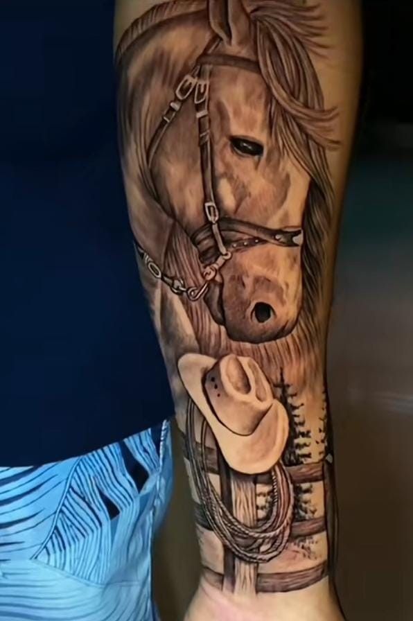 a horse with a cowboy hat and lasso tattoo on the leg