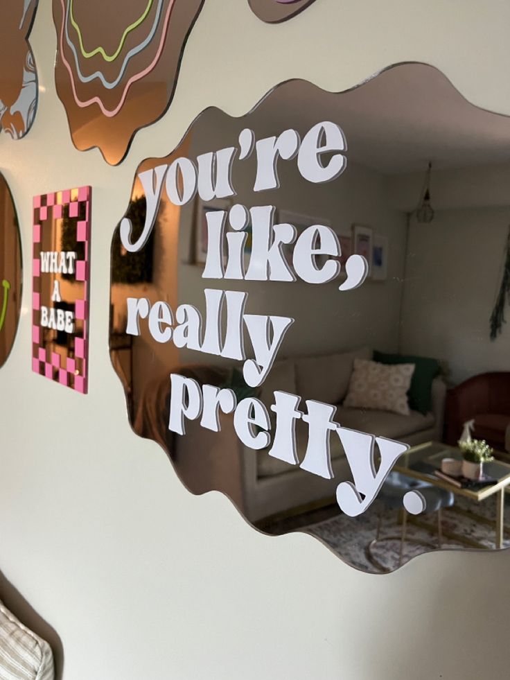 a mirror that says you're like really pretty on the side of a wall