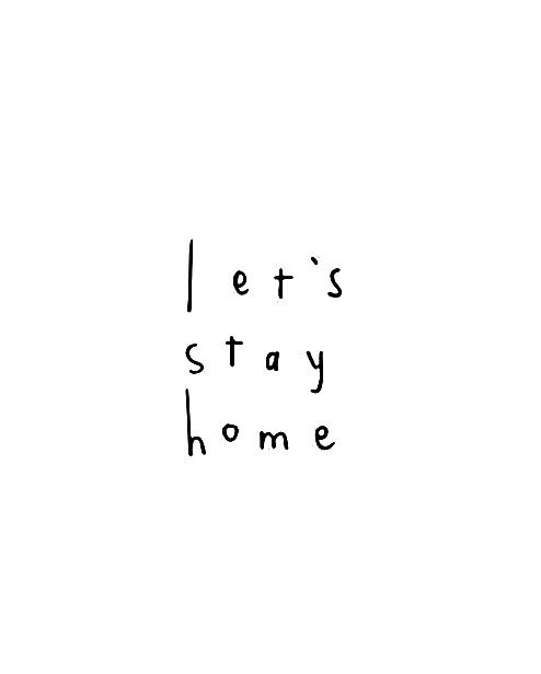 the words let's stay home written in black ink