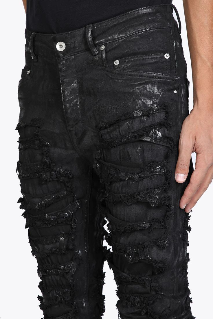 Rick Owens DRKSHDW Distressed Tyrone Jeans Designer's ID: DU02B4364-SBFLS Rick Owens DRKSHDW distressed Tyrone jeans, full length bootcut with a snug fit and low-rise. feature a button fly, angular front pockets, and laser-created frayed slash effect throughout. Made from lightweight stretch denim with a shiny foil treatment. Color: Black-Waxed Composition: 91% COTTON + 6% ELASTOMULTIESTER + 3% Made in ITALY Rick Owens Jeans, Slash Effect, White Chunky Knit Sweater, Black Distressed Jeans, Black Jeans Outfit, Black Ripped Jeans, Rick Owens Drkshdw, Destroyed Denim, Destroyed Jeans