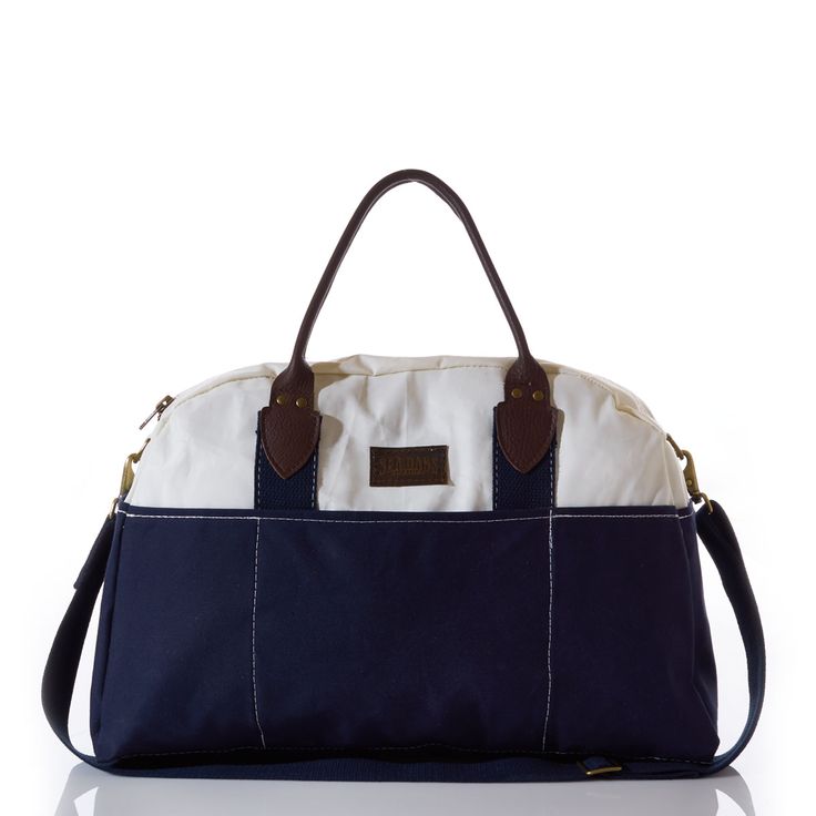 Sea Bags Recycled Sail Cloth Chebeague Island Weekender Navy - Inspired by the ferry ride to the scenic island off the coast of Maine, our bag is designed with premium leather handles, recycled sail cloth with a canvas bottom and embossed leather Sea Bags logo patch. The accents are what take this bag from casual to luxurious. Three outside pockets to store travel documents or other necessities. Sized perfectly for a weekend getaway, with an industrial zipper for closure and a detachable navy sh Recycled Sails, Sail Cloth, Recycled Sailcloth, Sail Bag, Picnic Tote, Sea Bags, Travel Documents, City Backpack, Recycle Bag