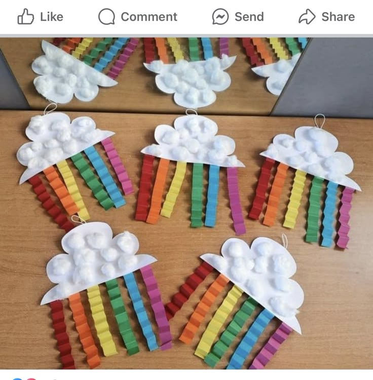 paper clouds and rainbows made out of popsicle sticks