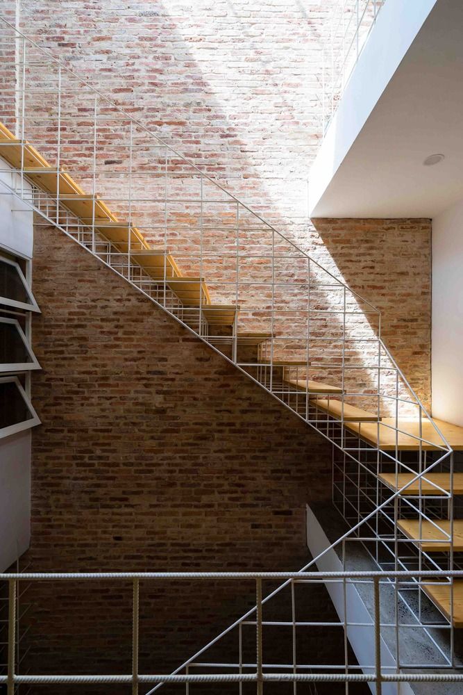 the stairs are made of metal and brick