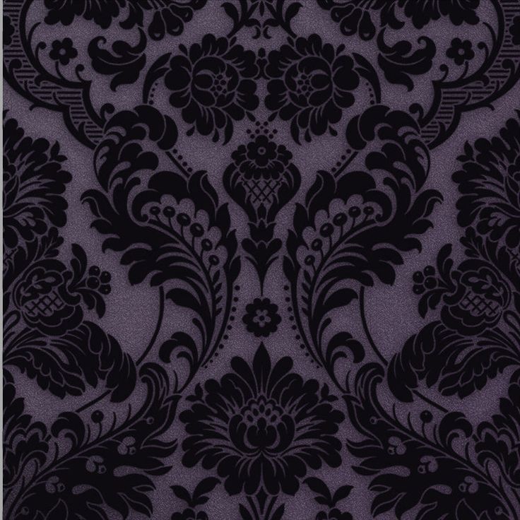 a black and white wallpaper with an ornate design on it's side,