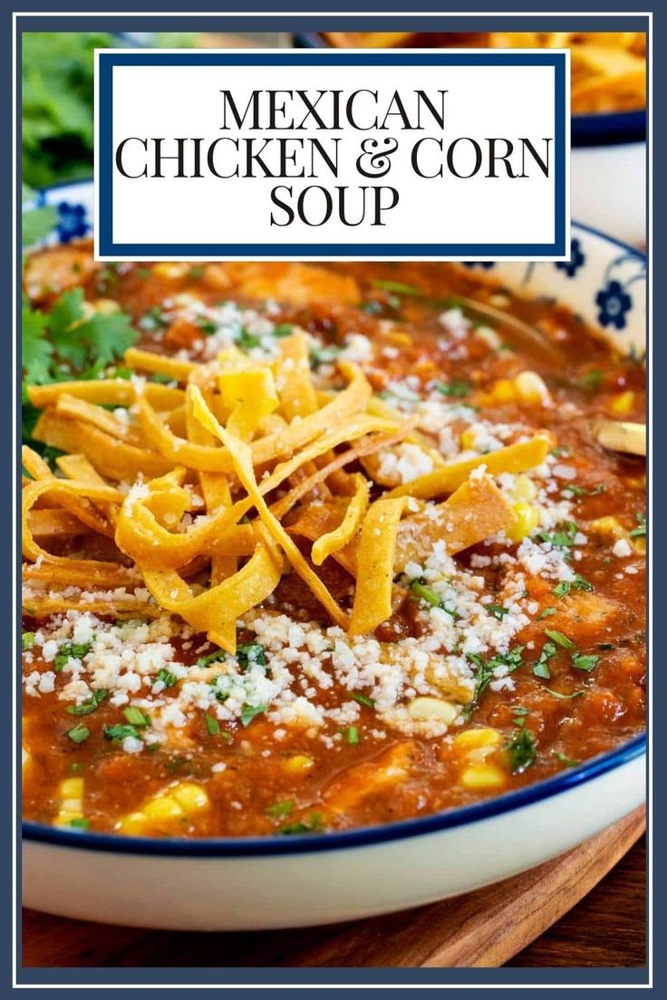 mexican chicken and corn soup in a bowl with parmesan cheese on the top