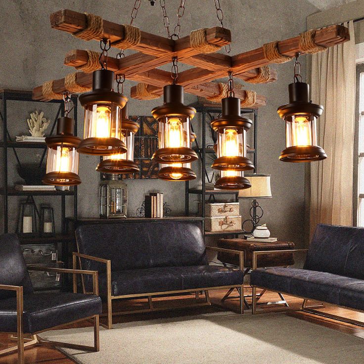 a living room filled with furniture and hanging lights