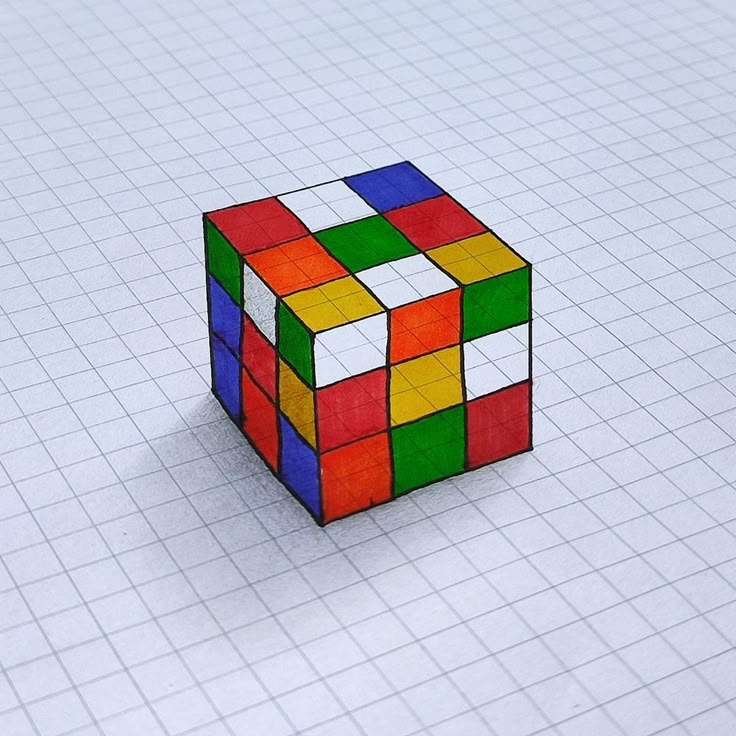 a rubik cube is shown on a sheet of graph paper