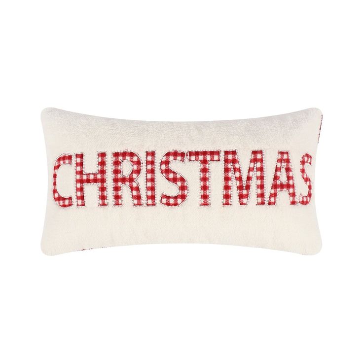 a red and white pillow with the word christmas on it