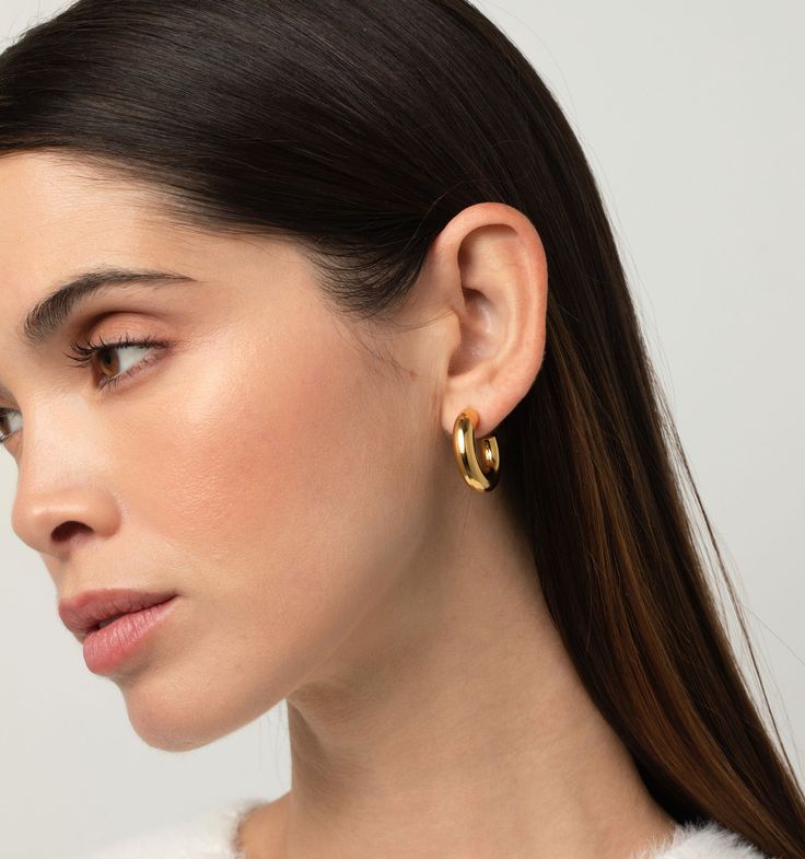 These are lightweight and waterproof! We love these classy hoop earrings for the size and chicness. Style these earrings up for a fun night out or make them an essential part of your daily line up. Trendy Huggie Earrings For Party, Modern Hypoallergenic Hoop Earrings For Parties, Modern Hoop Earrings For Everyday, Modern Round Tarnish-resistant Huggie Earrings, Elegant Yellow Gold Tarnish-resistant Hoop Earrings, Elegant 14k Gold-filled Tarnish-resistant Hoop Earrings, Chic Gold-tone Tarnish Resistant Hoop Earrings, Luxury Tarnish-resistant Brass Hoop Earrings, Skin Allergies