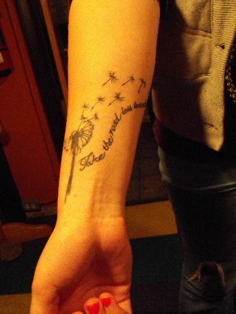 a person with a tattoo on their arm that reads, i love you to the moon and back