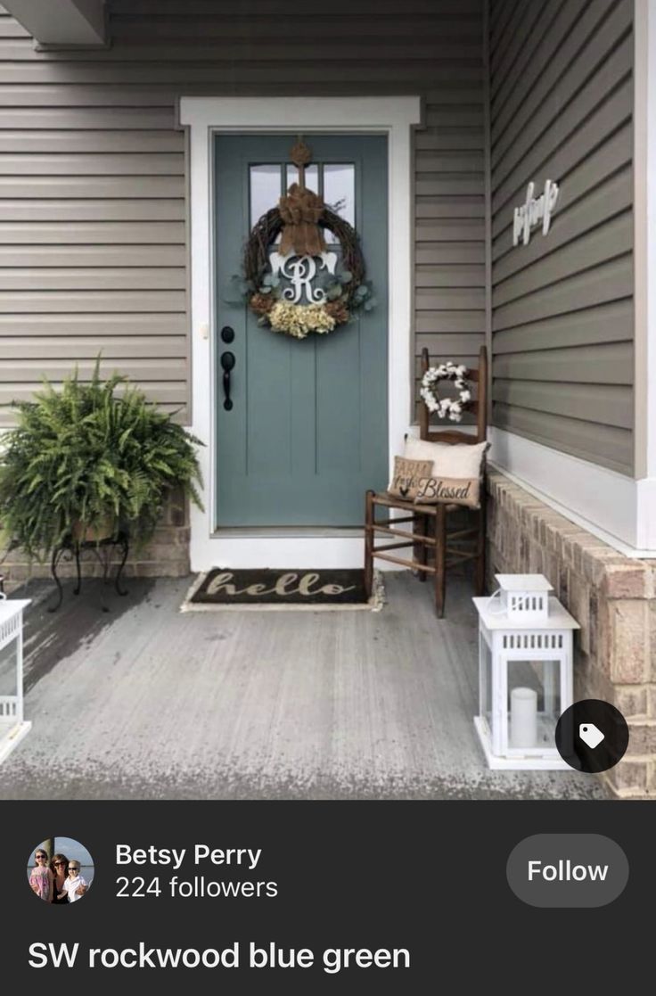 the front porch is decorated with wreaths and other decorations