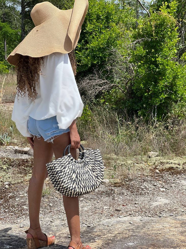 This Half-round Rattan Tote is the perfect bag for a boho babe on the go! The open top makes it easy to grab whatever you need, and the woven rattan grass straw material is sturdy and stylish. Plus, the natural color will complement any outfit. Product Details Material: Rattan﻿Shipping: ﻿Imported (est. 18 days)