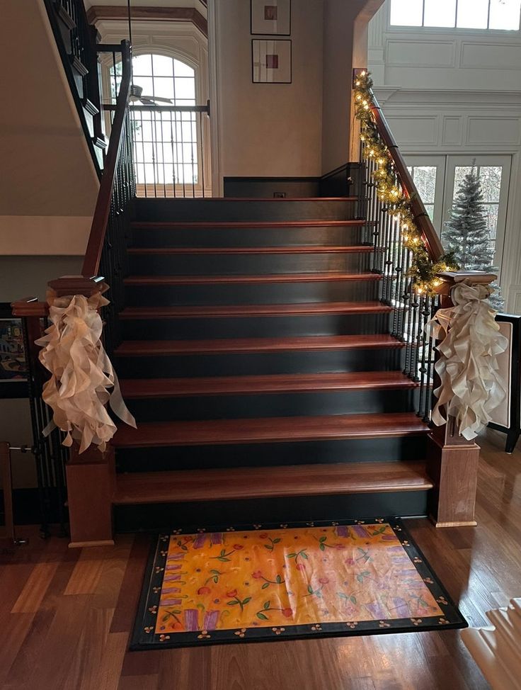 the stairs are decorated with bows and garlands