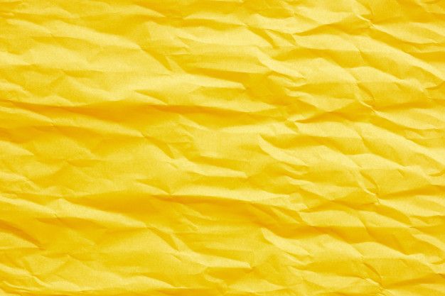 yellow crumpled paper textured with some sort of paint