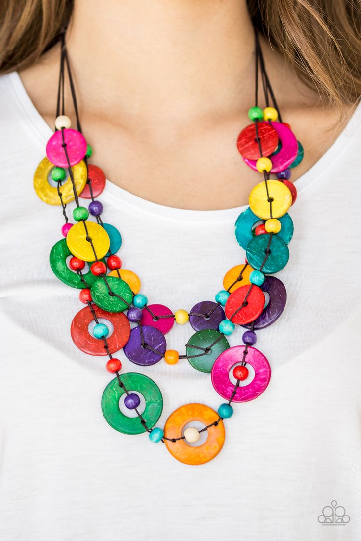 Brushed in a shell-like iridescence, vivacious multicolored wooden discs and round multicolored wooden beads are knotted along three strands of brown cording for a summery look. Features a button loop closure.

 Sold as one individual necklace. Includes one pair of matching earrings. Multi Necklace, Wooden Necklace, Wood Necklace, Paparazzi Accessories, Paparazzi Jewelry, Affordable Jewelry, Necklace Earring Set, Wooden Beads, Matching Earrings