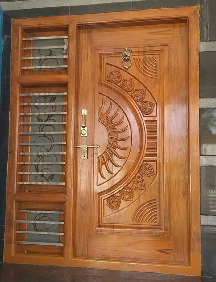 a wooden door with an intricate design on the front and side doors, which are made out of wood